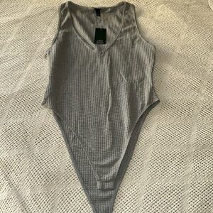 Gray bodysuit size medium.  NWT.